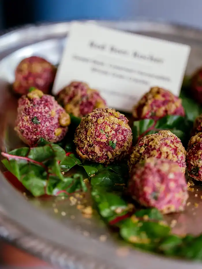 delicious seasonal passed appetizers, canapés, passed hors d'oeuvres, and grazing table at cocktail hour at a Catskills wedding at Roxbury Barn & Estate