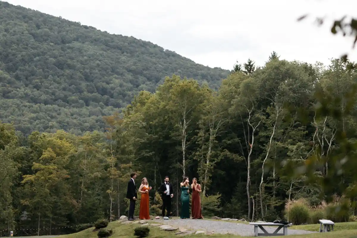 Guests playing Bocce Ball at the hilltop, during cocktail hour at a wedding at Roxbury Barn & Estate in the Central Catskills