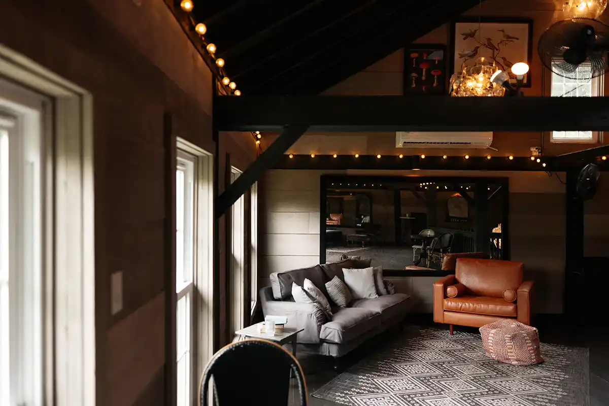 Lounge mezzanine on the upper level of the carriage barn at Roxbury Barn & Estate in the New York Catskills