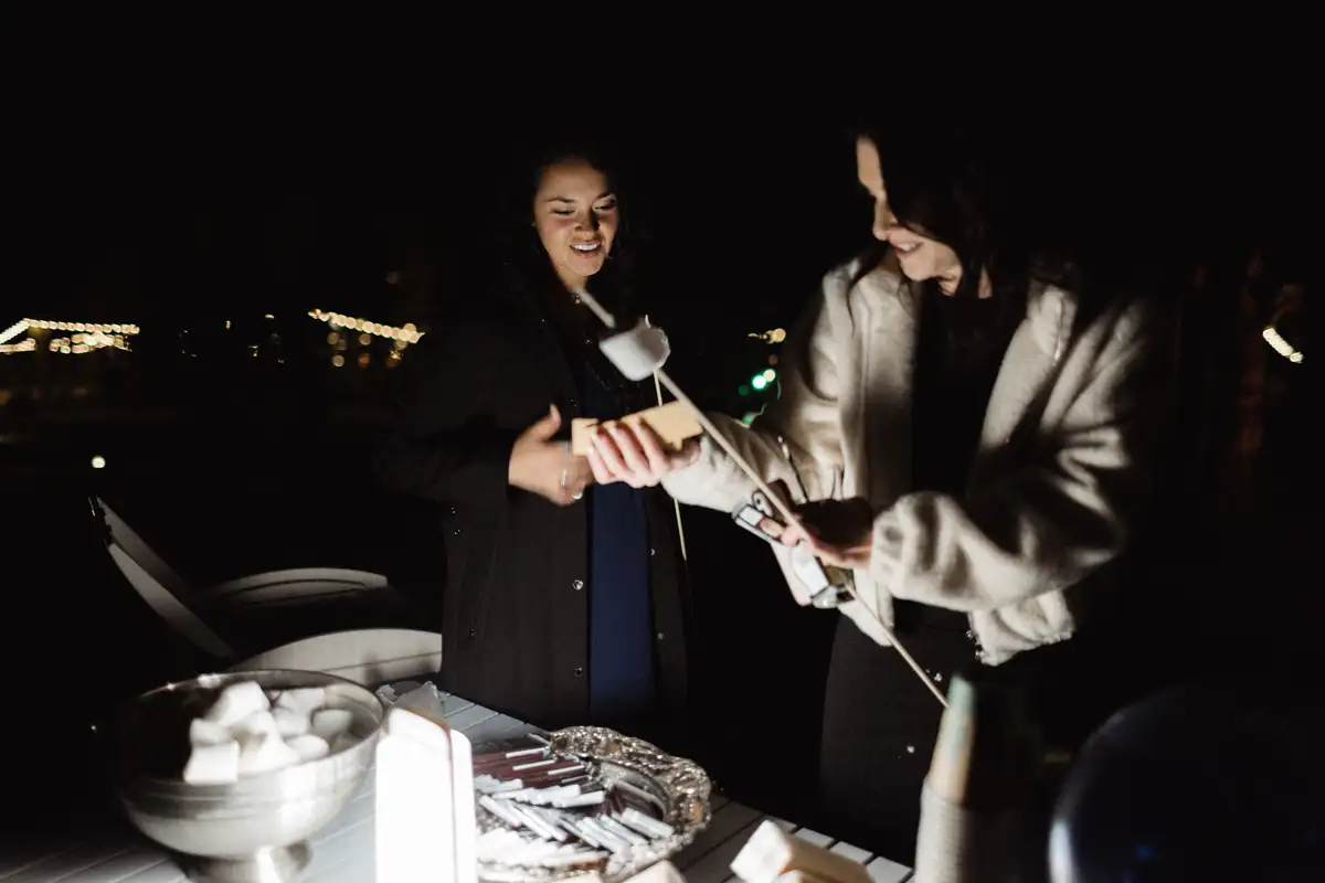 Making s'mores at an enormous bonfire at Roxbury Barn & Estate, one of most beautiful wedding venues in upstate NY