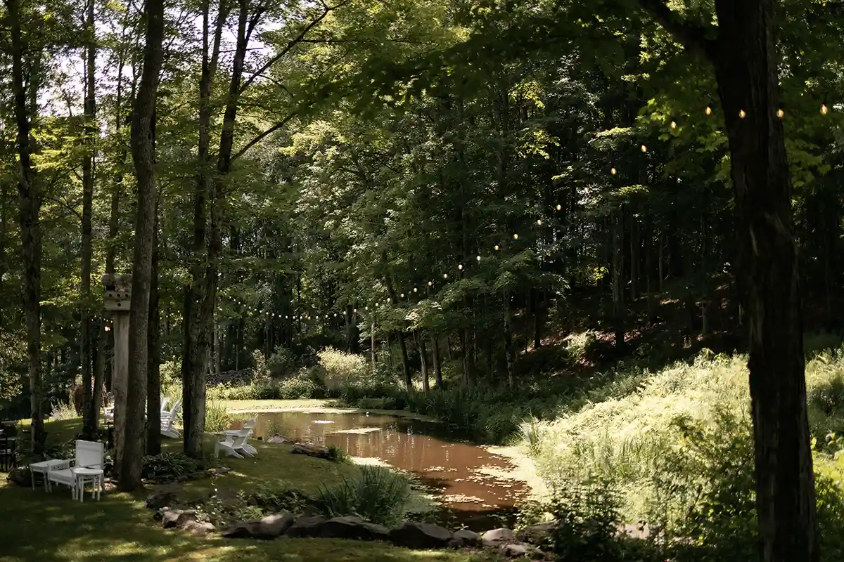 The ponds, flower beds, babbling brook, rolling lawns and beautiful nature of Roxbury Barn & Estate, a full service wedding venue in the Catskill Mountains of New York