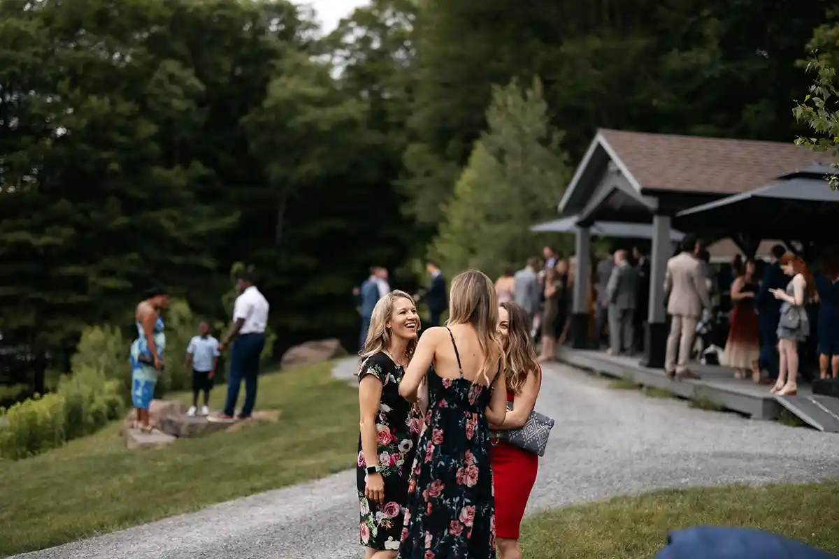 Wedding guests at cocktail hour at an indoor-outdoor wedding venue in Upstate New York
